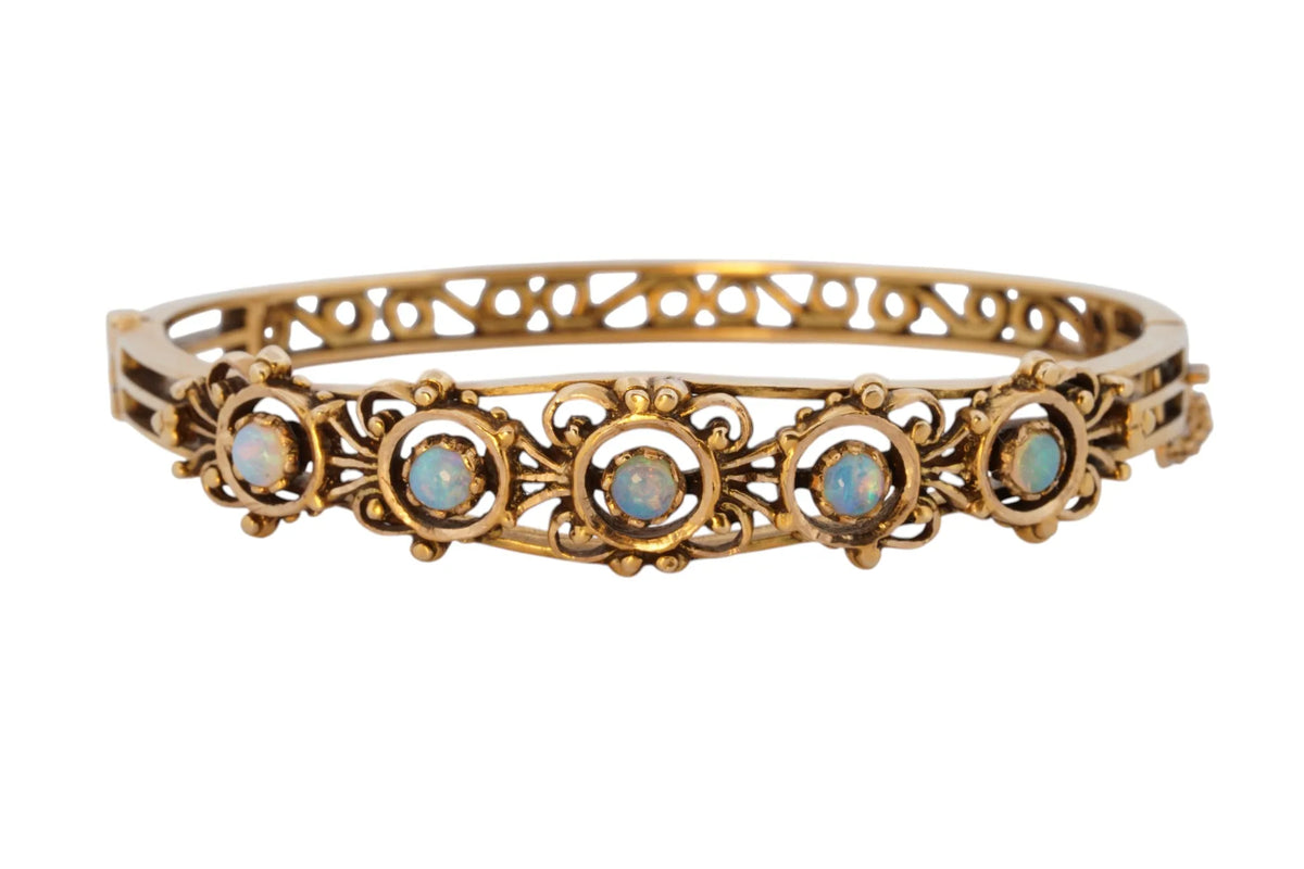 Vintage handmade 14K yellow gold opal bangle bracelet, 360-degree view frame 1 of 36