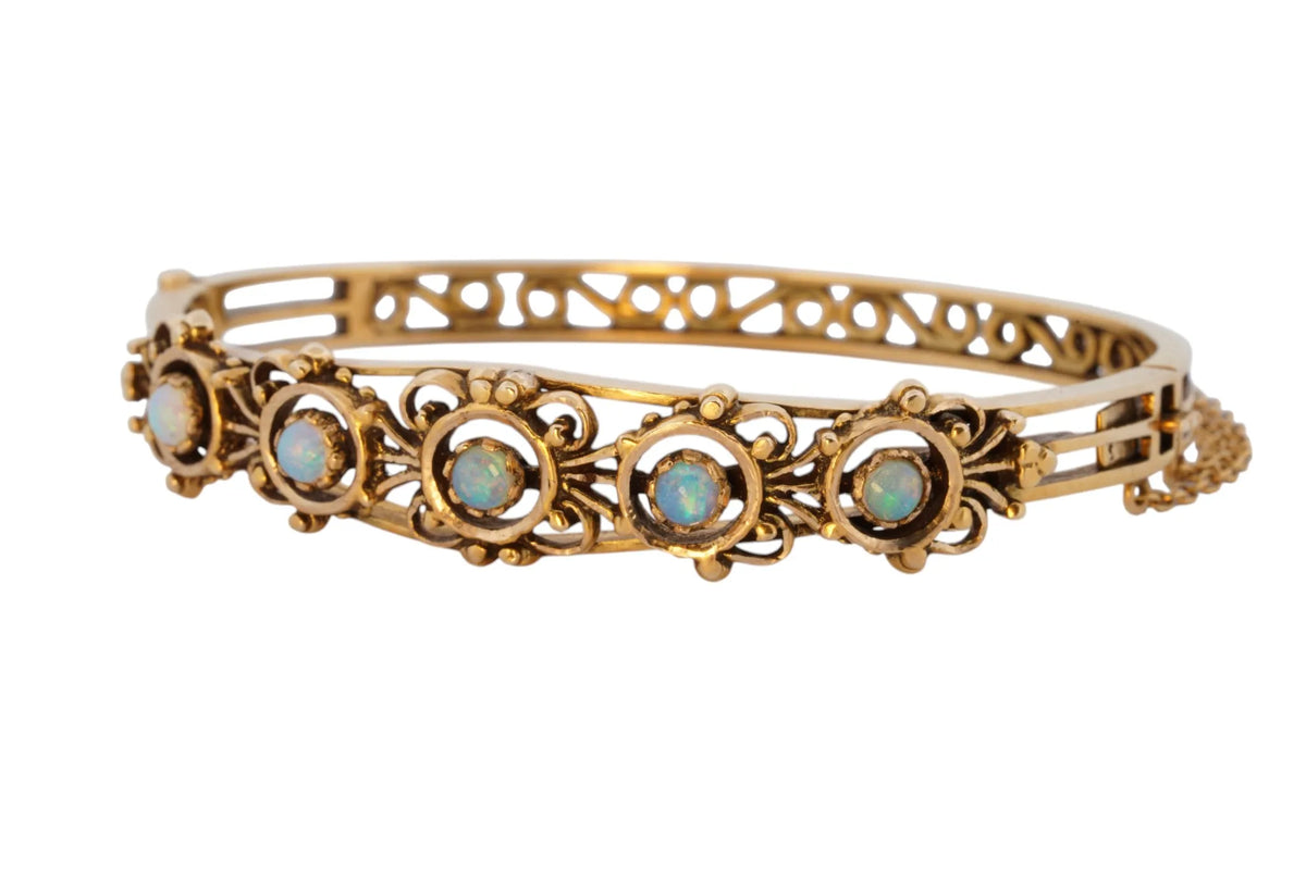 Vintage handmade 14K yellow gold opal bangle bracelet, 360-degree view frame 3 of 36