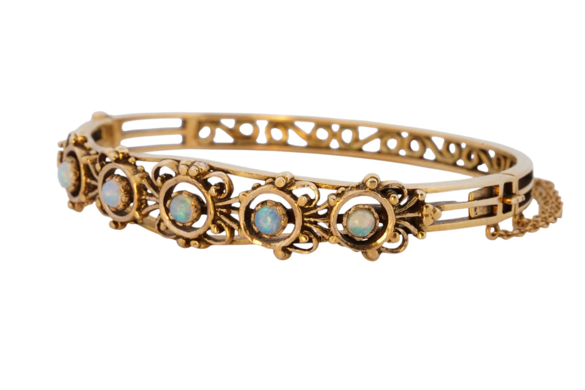 Vintage handmade 14K yellow gold opal bangle bracelet, 360-degree view frame 4 of 36