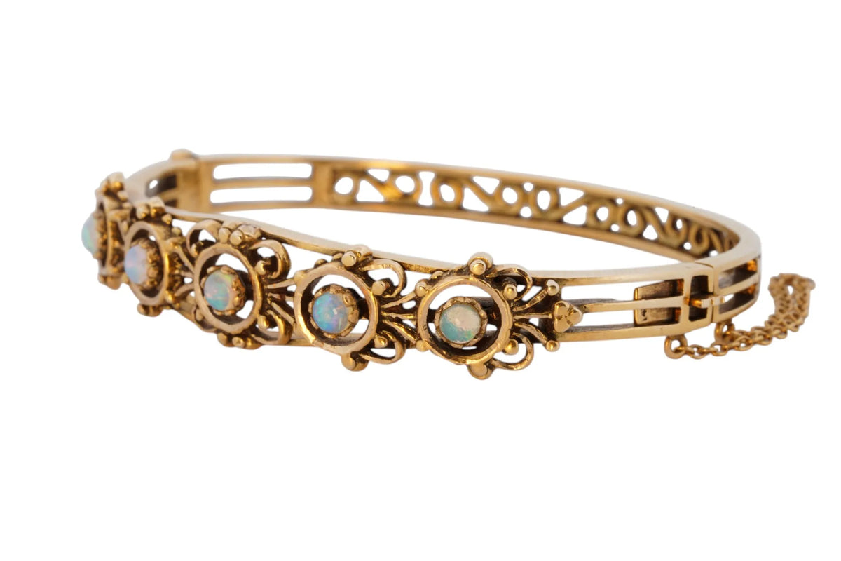 Vintage handmade 14K yellow gold opal bangle bracelet, 360-degree view frame 5 of 36