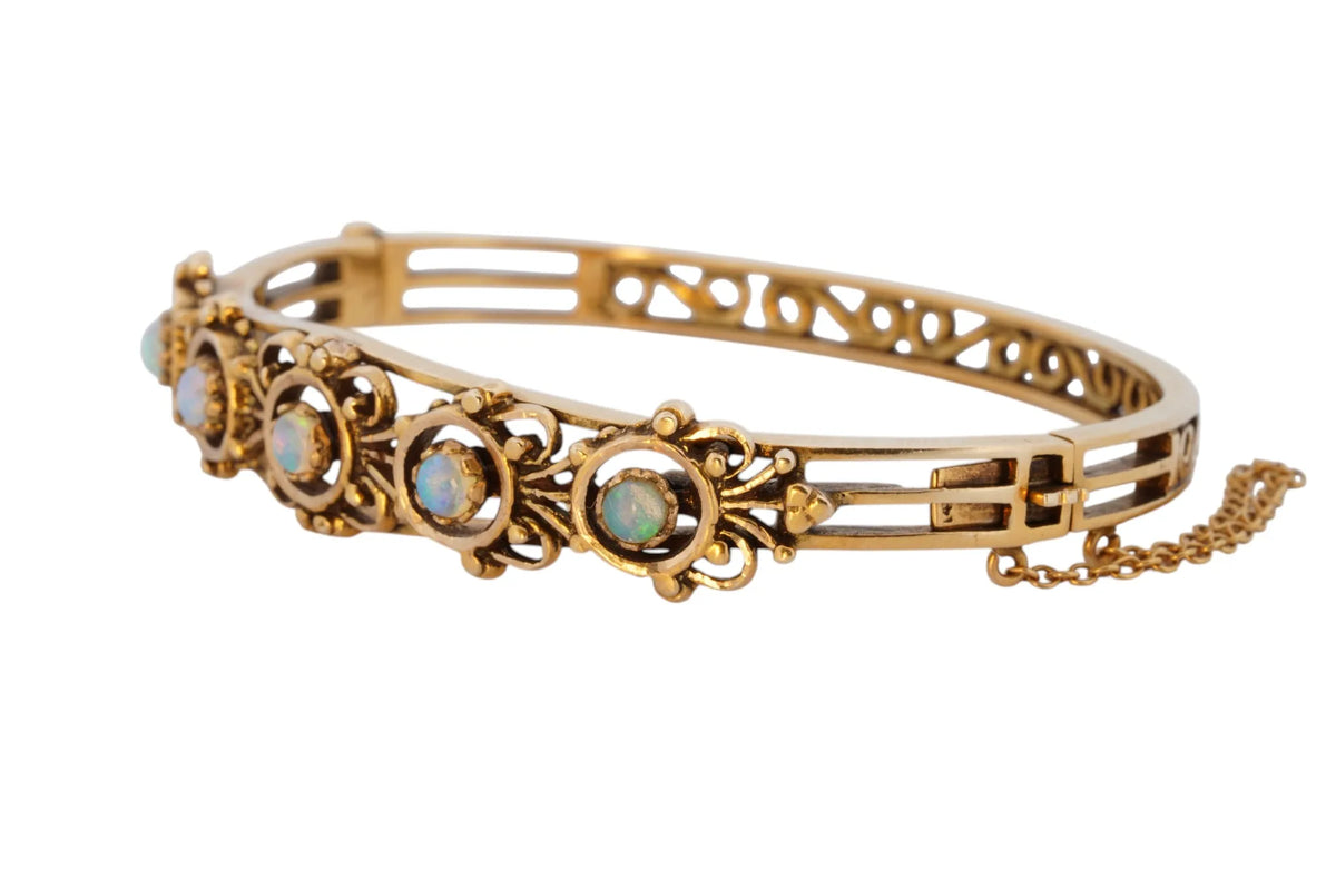 Vintage handmade 14K yellow gold opal bangle bracelet, 360-degree view frame 6 of 36