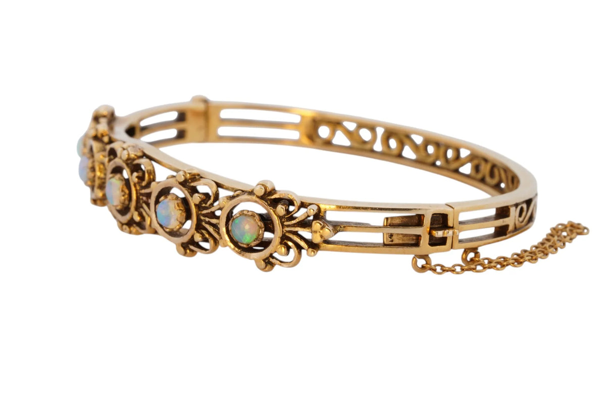 Vintage handmade 14K yellow gold opal bangle bracelet, 360-degree view frame 7 of 36
