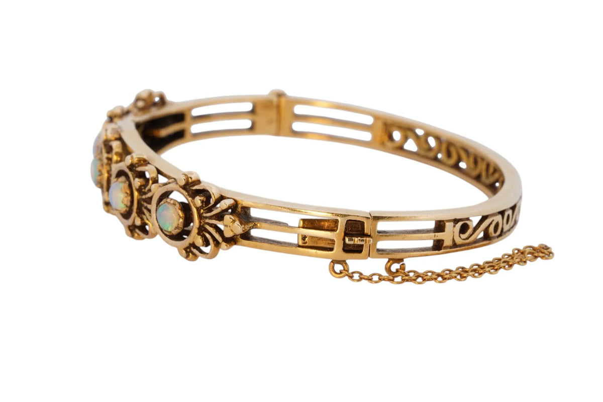 Vintage handmade 14K yellow gold opal bangle bracelet, 360-degree view frame 9 of 36