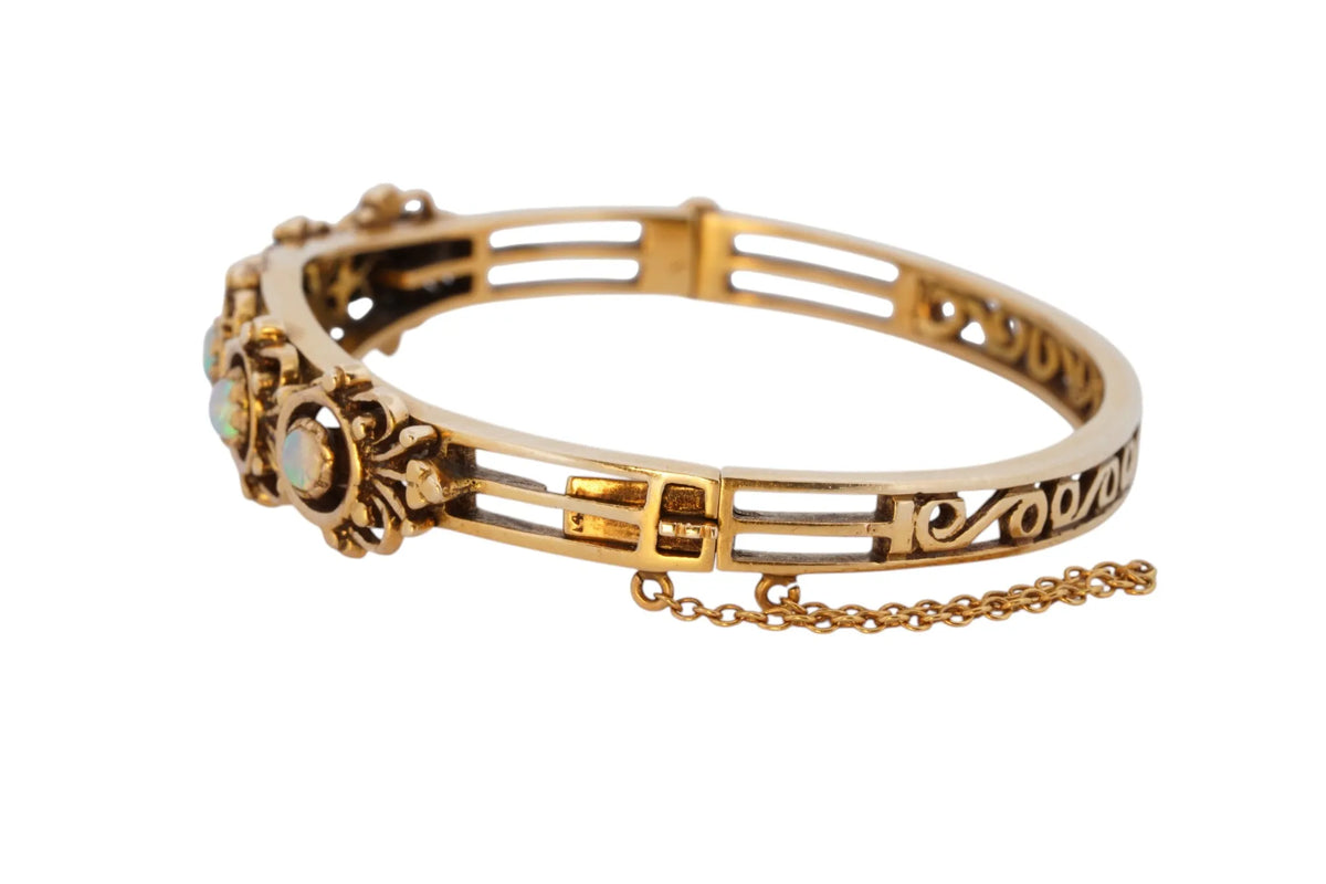 Vintage handmade 14K yellow gold opal bangle bracelet, 360-degree view frame 10 of 36