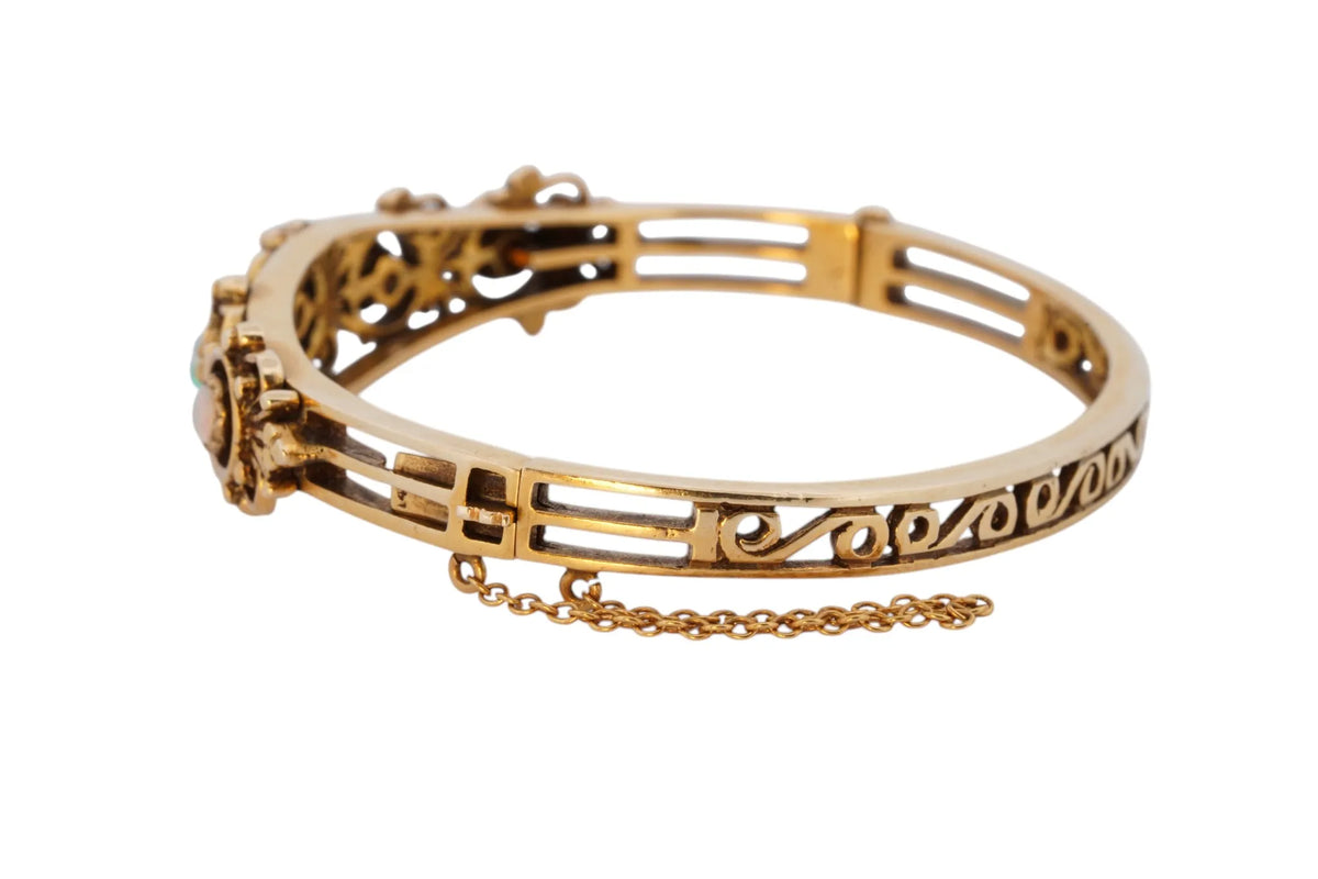 Vintage handmade 14K yellow gold opal bangle bracelet, 360-degree view frame 12 of 36