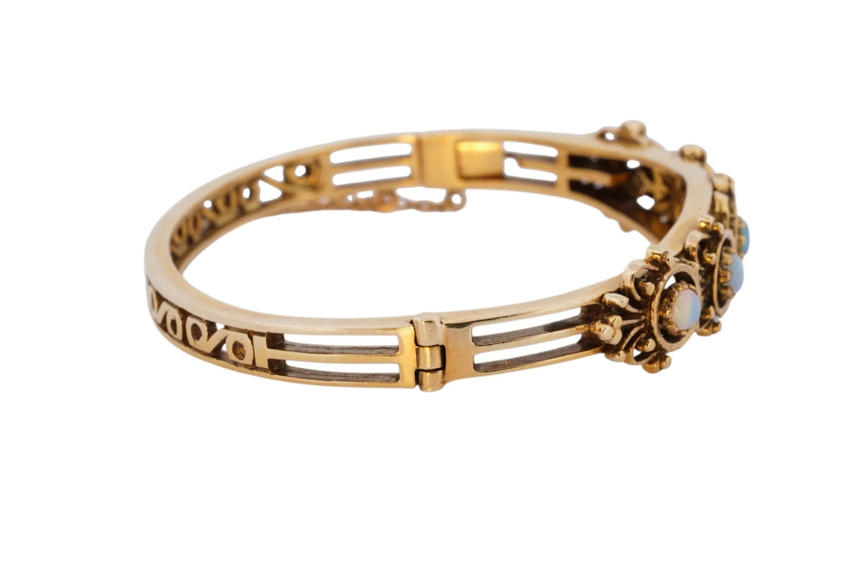 Vintage handmade 14K yellow gold opal bangle bracelet, 360-degree view frame 28 of 36