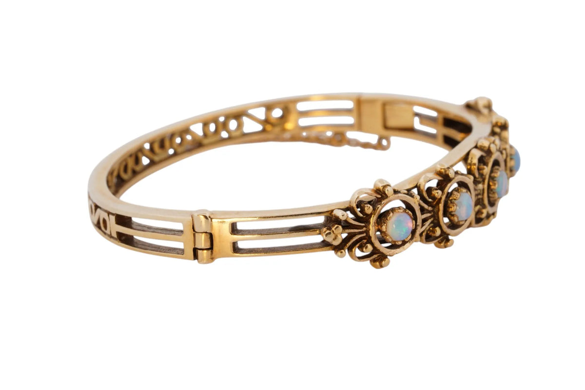 Vintage handmade 14K yellow gold opal bangle bracelet, 360-degree view frame 30 of 36