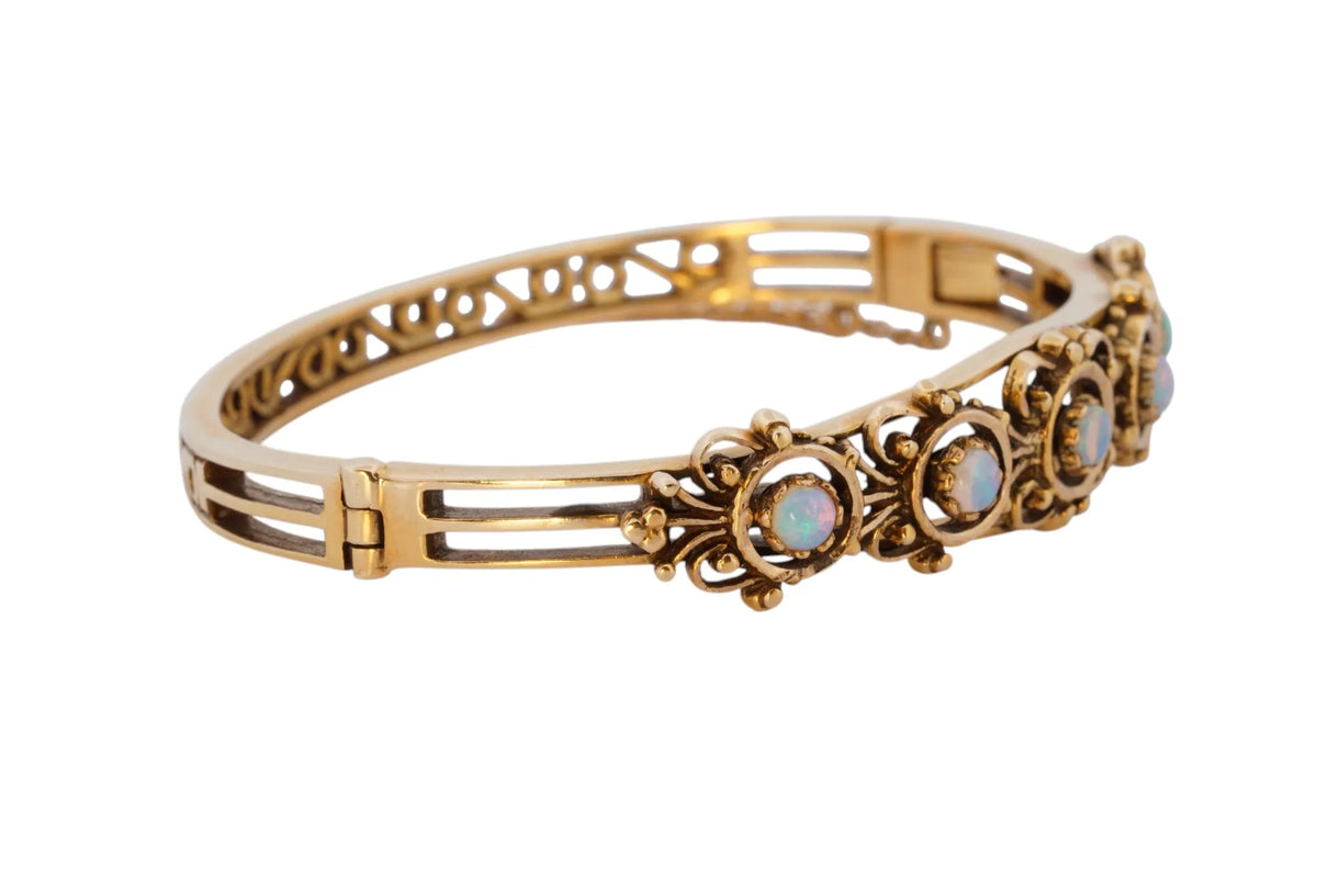Vintage handmade 14K yellow gold opal bangle bracelet, 360-degree view frame 31 of 36