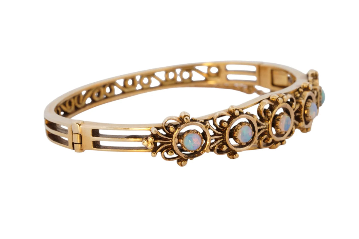 Vintage handmade 14K yellow gold opal bangle bracelet, 360-degree view frame 32 of 36