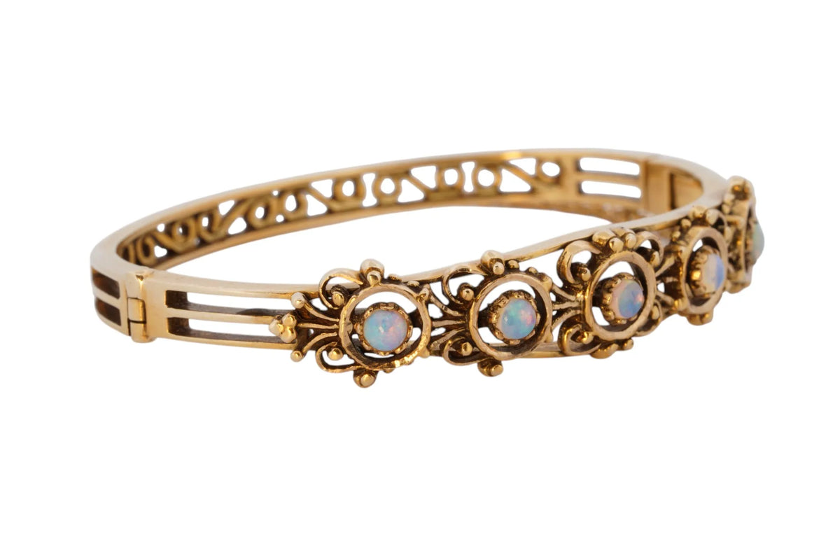 Vintage handmade 14K yellow gold opal bangle bracelet, 360-degree view frame 33 of 36