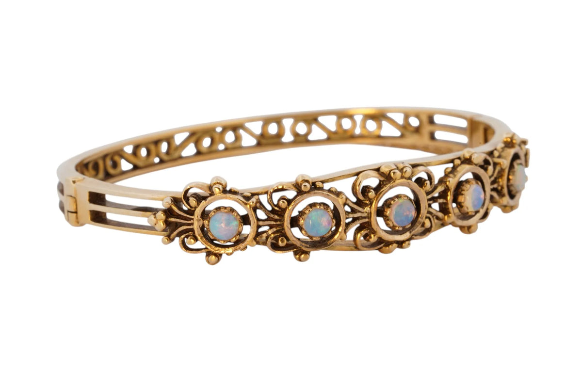 Vintage handmade 14K yellow gold opal bangle bracelet, 360-degree view frame 34 of 36