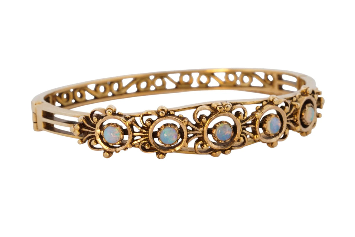 Vintage handmade 14K yellow gold opal bangle bracelet, 360-degree view frame 35 of 36