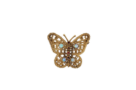 Vintage handmade 14K gold butterfly brooch with opals and garnets, front view